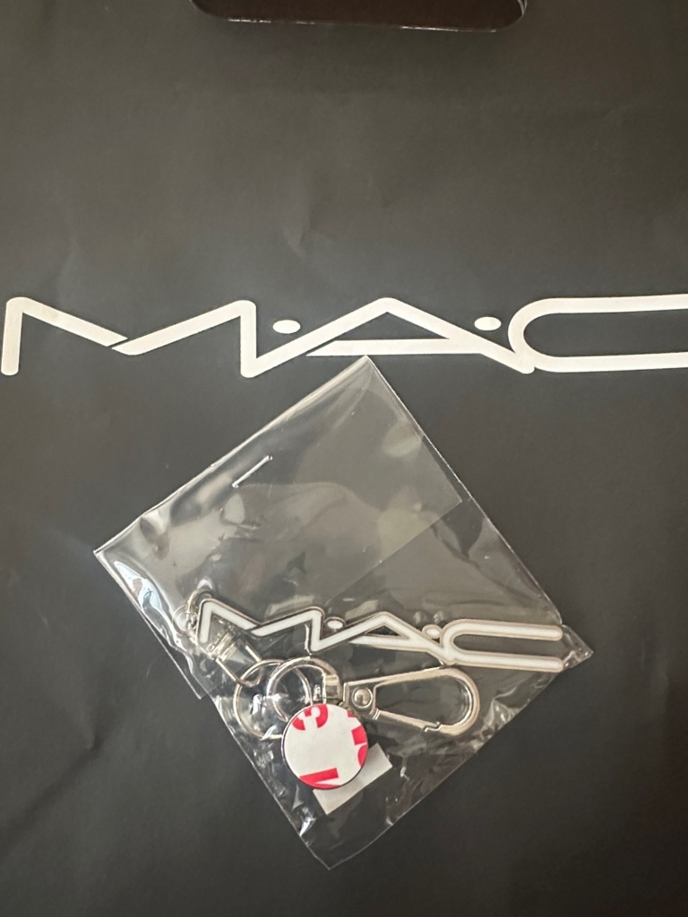 MAC COSMETICS, SILVER, AND WHITE KEYCHAIN LOGO